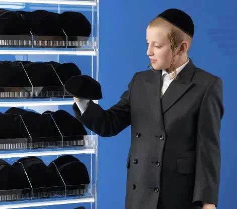 Row of Netila washable yarmulkas on a display rack